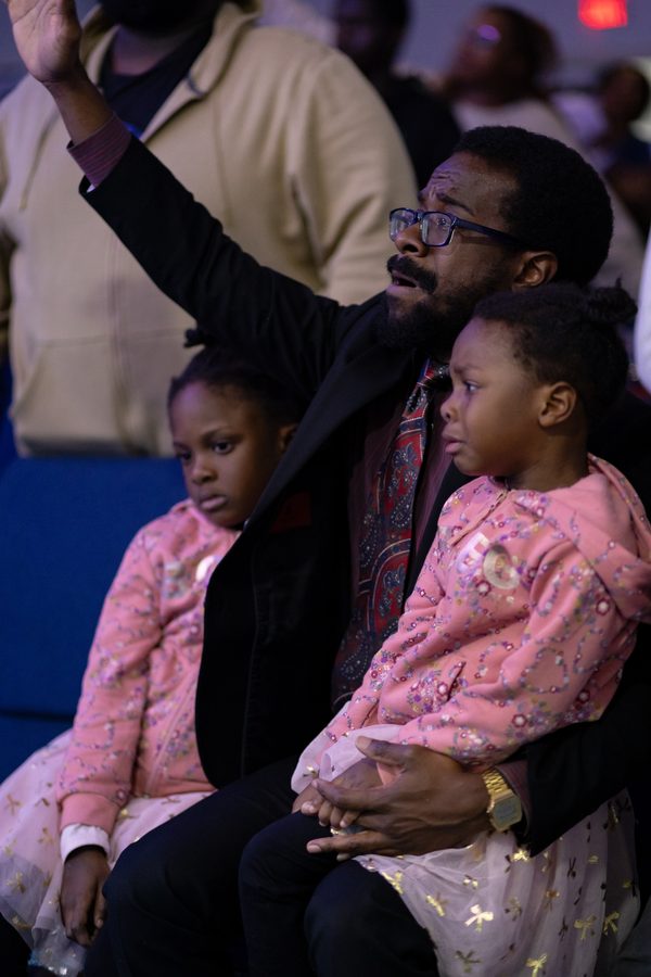 Father and children in worship