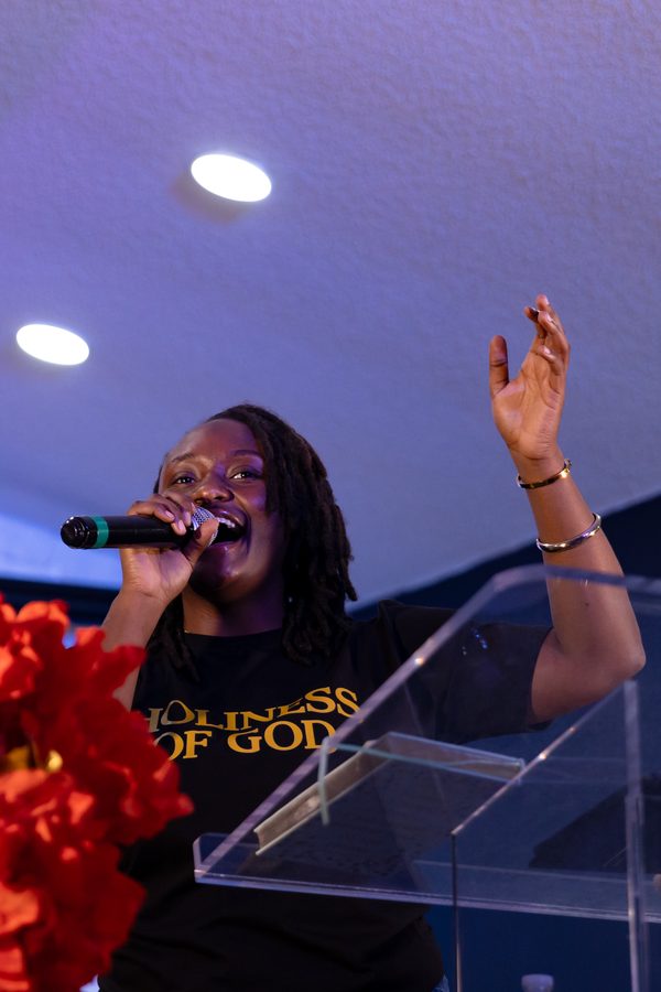 Vocalist leading worship on stage