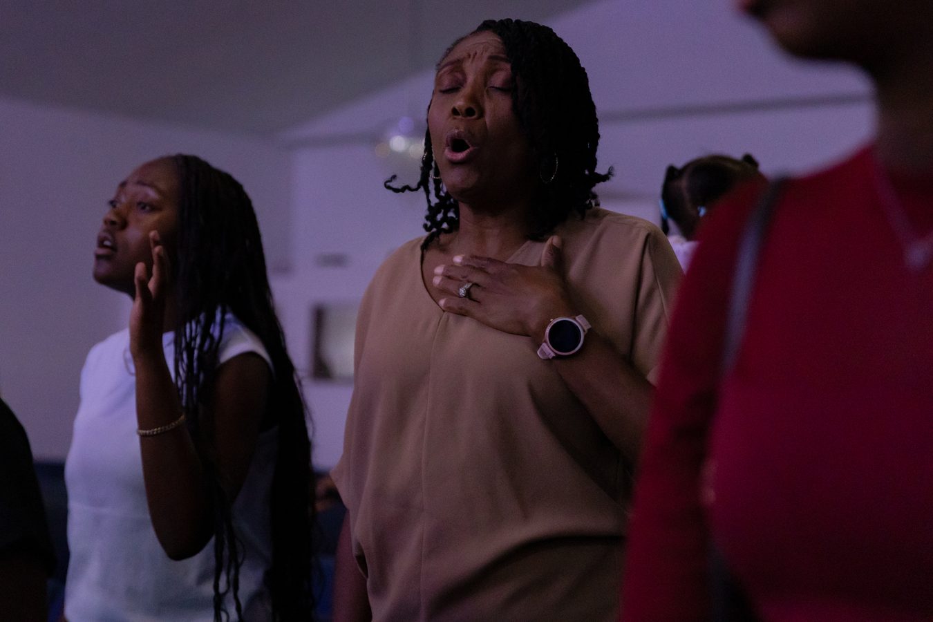 Congregation members in worship